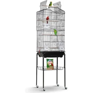 Stainless bird cage with colorful birds perched inside and food storage below