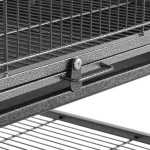 Close-up of stainless bird cage latch and wire shelving details